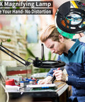 Man using 12X Magnifying Glass With Light LED Lamp Clamp On Arm for close up electronics work and DIY hobby repairs.