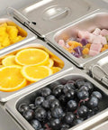 Eight Pack Steam Table Pans 1/6 Size 2.5 Inch Deep Stainless Steel Anti Jam Food Pans filled with fruits and candies