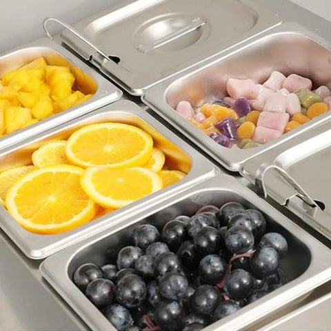 Eight Pack Steam Table Pans 1/6 Size 2.5 Inch Deep Stainless Steel Anti Jam Food Pans filled with fruits and candies
