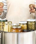 12 Inch Stainless Steel Canning Rack With Contour Handles For Pressure Canner Pot Holds 7 Pint Or 6 Quart Jars in use