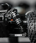 Close-up of 59mm Aluminum Oil Shocks with Adjustable Damping mounted on RC car, showing CNC machined aluminum construction and nylon rod ends.