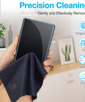 Close-up of dark blue SmoTecQ microfiber cleaning cloth (7×6 in) used on a smartphone screen