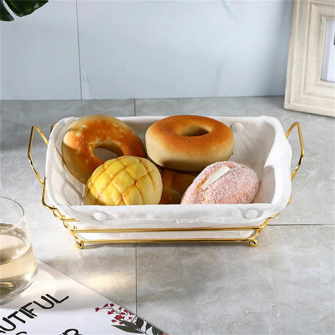 Gold Wire Serving Basket For Fruit And Bread with linen liner holding assorted breads on a kitchen counter