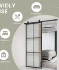 Heavy Duty Three Panel Sliding Barn Door With Crisp Tempered Glass And Dark Aluminum Frame Modern French Look in a living space.