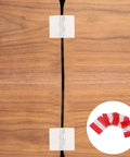 Acrylic Folding Hinges With Self Adhesive Mounts for cabinets and boxes shown on a wooden surface.