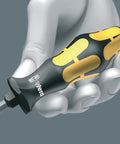 Hand holding Kraftform Big Pack 900 13 Piece Slotted Phillips Pozidriv Torx Screwdriver Set For Fastening Chiseling And Loosening.