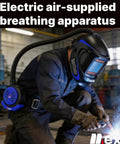 Welder using Powered Air Purifying Welding Helmet With Rechargeable Respirator System True Color Vision 4 Arc Sensors in workshop