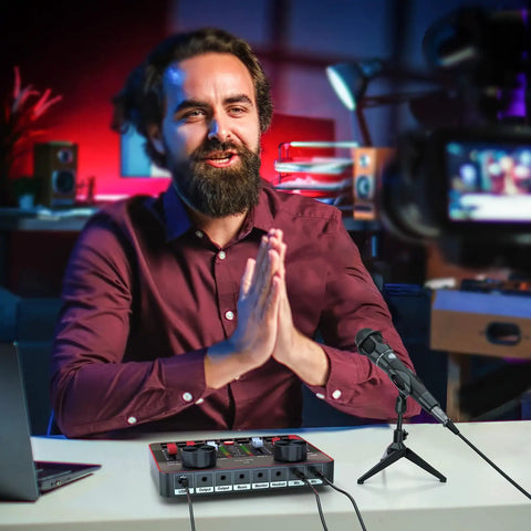 Content creator using Podcast Setup Bundle For Two Mics TikTok Live Streaming Content Creator Kit with audio interface in studio.