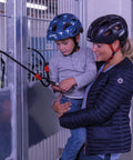 Mother and child using Fingerprint Smart Lock with 360 Degree Recognition for Quick Access, no key needed, secured to a gate.