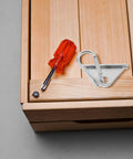 Top Notch Silver Aluminum Triangle Sliding Hooks For T Slot Tracks on wooden surface with screwdriver and screw.