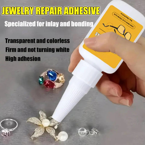 Hand holding jewelry repair adhesive with nozzle near rings and earrings, showcasing transparent glue for metal and gemstone repairs.