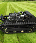 Side view of Remote Control RC Lawn Mower With Tracks For Slopes And Rough Terrain on grass, showing its rugged build.