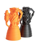 Orange and black 3D printed rocket engine models created with MK4S 3D Printer Kit With Automatic Calibration And Removable Sheets