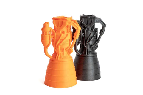 Orange and black 3D printed rocket engine models created with MK4S 3D Printer Kit With Automatic Calibration And Removable Sheets