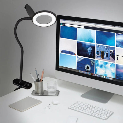 LED Clip On Magnifying Glass With Light For Crafting And Needlework Hands Free Adjustable Arm Desk Lamp in use on a desk setup.