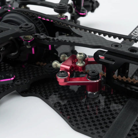 Close-up of Durable Aluminum Alloy Steering Kit for 1 to 10 scale RC drift cars with CNC machined assembly in ultra pink accent.