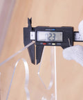 Measuring thickness of 12 By 10 Inch Heart Inlay Router Template Guide Kit For Woodworkers with digital caliper.