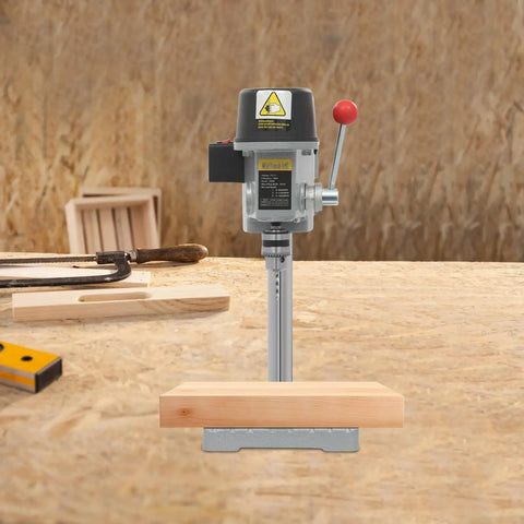 Sturdy Mini Bench Drill Press For Woodworking And Metal Crafting on a workbench with wooden base and tools in background.