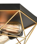 Close-up of Brass Industrial Flush Mount Ceiling Light 3 Light Square Cage Fixture in Black and Gold with glowing bulbs