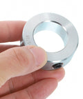 Set Screw Shaft Collars 1-1/16 Inch Bore, 1-3/4 Inch Outside Diameter, 5/8 Inch Width, Zinc Plated Carbon Steel Locking Clamp for Linear Rod Guides, Heavy-Duty Rock-Solid Positioning Spacers That Lock Down. Hand holding zinc plated shaft collar