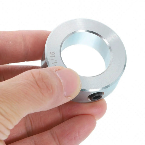 Set Screw Shaft Collars 1-1/16 Inch Bore, 1-3/4 Inch Outside Diameter, 5/8 Inch Width, Zinc Plated Carbon Steel Locking Clamp for Linear Rod Guides, Heavy-Duty Rock-Solid Positioning Spacers That Lock Down. Hand holding zinc plated shaft collar
