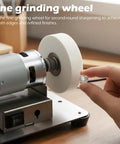 Hella Versatile Mini Bench Grinder Fitted With Three High Speed Buffing Wheels For Razor Knife Sharpening And Spotless Metal Polish. Close-up of fine grinding wheel.