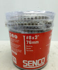 Close-up of Senco 3-inch #8 decking screws package with label details and visible screws inside.