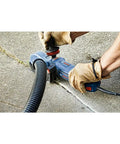 Person using Beefy 4-1/2 Inch Segmented Rim V Groove Diamond Blade for universal rough cuts on concrete with power tool.