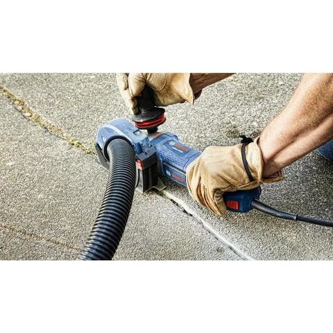 Person using Beefy 4-1/2 Inch Segmented Rim V Groove Diamond Blade for universal rough cuts on concrete with power tool.
