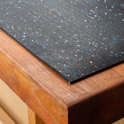 Heavy Duty Rubber Workbench Mat 2x5 Feet for Woodworking, Garage, and Tool Benches, corner view on wood surface