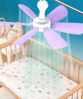 6 Leaves Ceiling Fan with Remote Control for Outdoor USB, purple blades above a crib for cool airflow in a nursery.