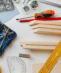 Workbench scene with tools and 20 Pack Stainless Steel Straight Brackets With Screws Flat Plate Repair Brackets For Furniture Woodwork.