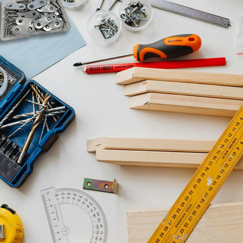 Workbench scene with tools and 20 Pack Stainless Steel Straight Brackets With Screws Flat Plate Repair Brackets For Furniture Woodwork.