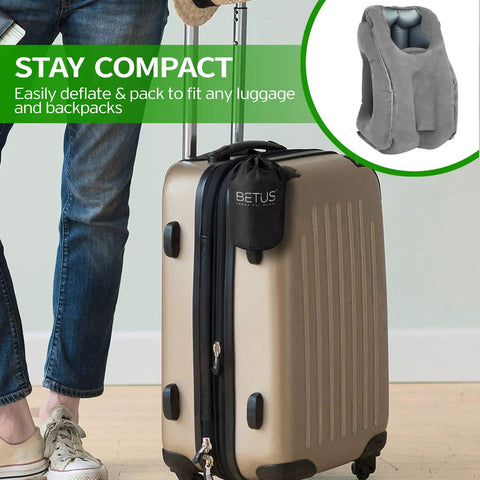 Ergonomic Inflatable Travel Pillow For Planes With Neck Support And Comfy Head Rest For Long Flights beside suitcase