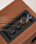 Control panel of Powered Bluetooth 5.3 Bookshelf Speakers with 60W Peak Output, volume, treble, and bass knobs, wooden finish.