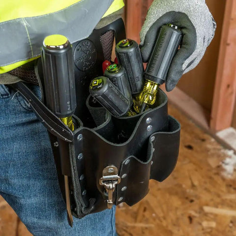 Technician with tool belt holding 4 Piece Square Recess Screwdriver Set With Color Coded Handles Heat Treated Chrome Plated Shafts