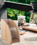 Sweet Wooden Coffee Filter Holder Box Fan Design Compact Countertop Storage Organizer For Hand Drip Brewing on a wooden table.