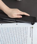 Hand using Three Hole Punch For Office And Home Use No Fuss Ten Sheets Puncher With Durable Metal Construction Black Finish