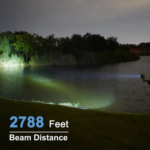 TacticPro 2000 Lumen HID Spotlight Floodlight beam illuminating a lake shore, showing 2788 feet beam distance