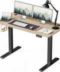 Furmax Maple Computer Desk 48 X 24 Inches Electric Height Adjustable Standing Desk with dual monitors and accessories.