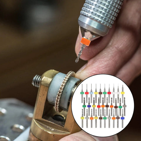 Close-up of Dope Carbide Micro Drill Bits Set for Jewelry Making and PCB Engraving, showing detail work on metal piece.