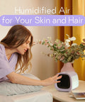 Woman enjoying humidified air from Kickback Portable Evaporative Air Cooler AC Unit With Four Speed Settings And One Button Control.