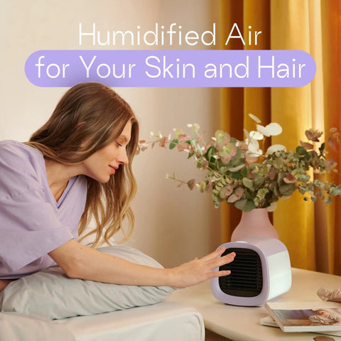 Woman enjoying humidified air from Kickback Portable Evaporative Air Cooler AC Unit With Four Speed Settings And One Button Control.