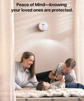 Standalone Smoke And Carbon Monoxide Detector SC01 1 Pack A Cinch To Install Battery Powered Home Safety Alarm For Early Fire And Gas Alert No Wi Fi No Interconnection Reliable Detection For Peace Of Mind. White detector on wall above family in bedroom