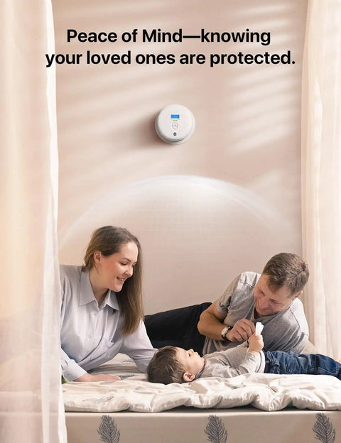 Standalone Smoke And Carbon Monoxide Detector SC01 1 Pack A Cinch To Install Battery Powered Home Safety Alarm For Early Fire And Gas Alert No Wi Fi No Interconnection Reliable Detection For Peace Of Mind. White detector on wall above family in bedroom