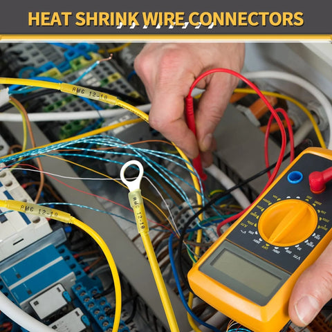 Close-up of yellow marine-grade heat shrink wire connectors with ring terminals inside an electrical panel