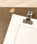 Concealed Cabinet Hinge Jig With 35 Mm Forstner Bit And Metal Bushing Drill Guide For Framed And Frameless Cabinets Precise Hinge Cup Holes Edge Alignment Tips Durable Diy Ready Jig For Fast Accurate Installations showing installed hinge on cabinet door.