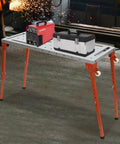 Rock Solid Foldable Welding Bench With Killer 1000 Lb Load Rating And Smooth Height Adjustments From 13 To 21 Inches with toolbox and welder.
