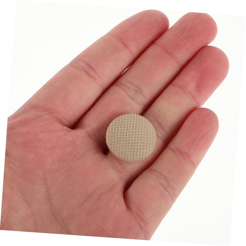 Person holding a beige snap rivet, part of the All In One Car Roof Repair Kit For Headliner And Interior Fixes, Upholstery Glue And Buckle Tool, Snap Rivet Retainer And Ceiling Repair Set For Auto Roof Quick DIY Interior Restoration