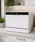 Hassle Free Countertop Dishwasher With Stainless Steel Tub And Delay Start For Small Apartments And Condos Quick Plug In Portable Washer With Smart Screen and Six Place Settings on kitchen counter.